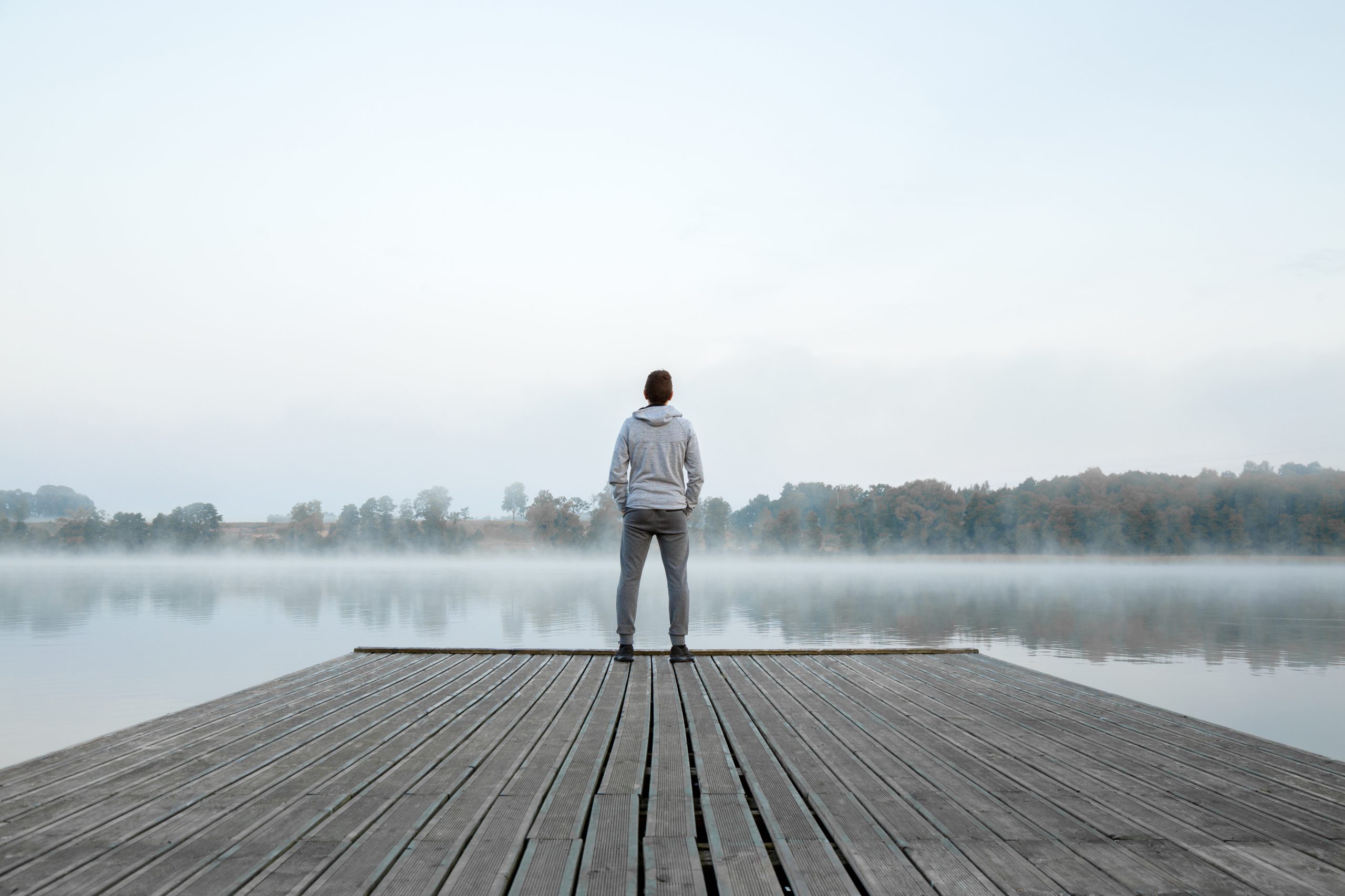 Man-on-dock-in-mist