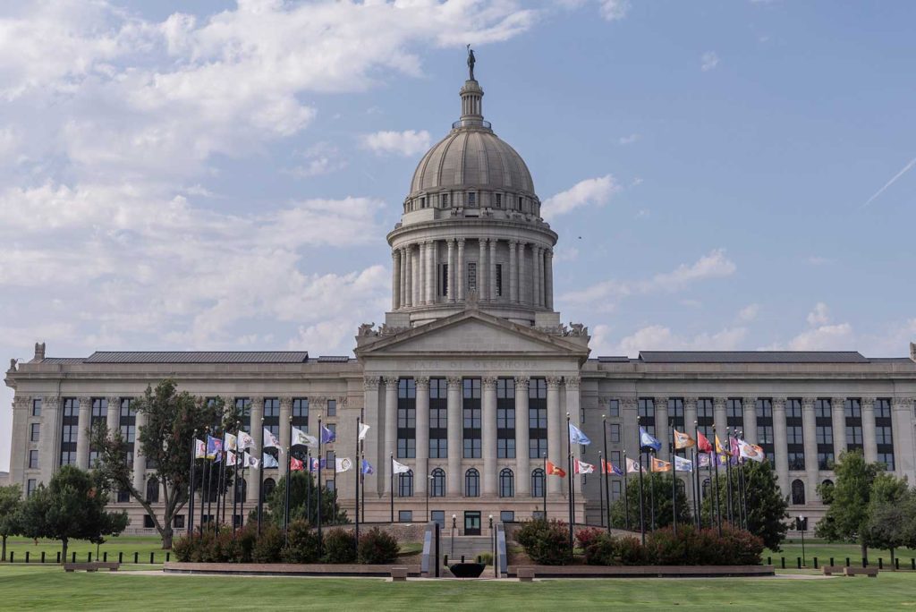 Exterior photo of the Oklahoma State Capitol building on a spring day